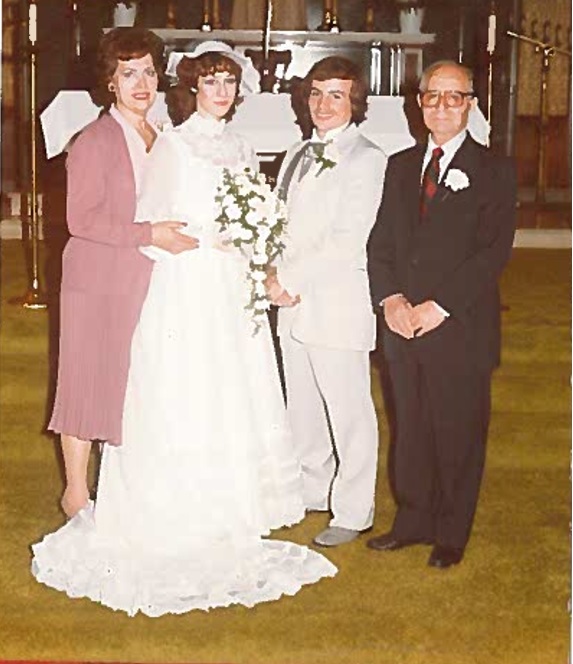 The bride’s parents, Annanina and Joseph Colonna, are pictured with the married couple. Photo courtesy of Lisa Healy. 